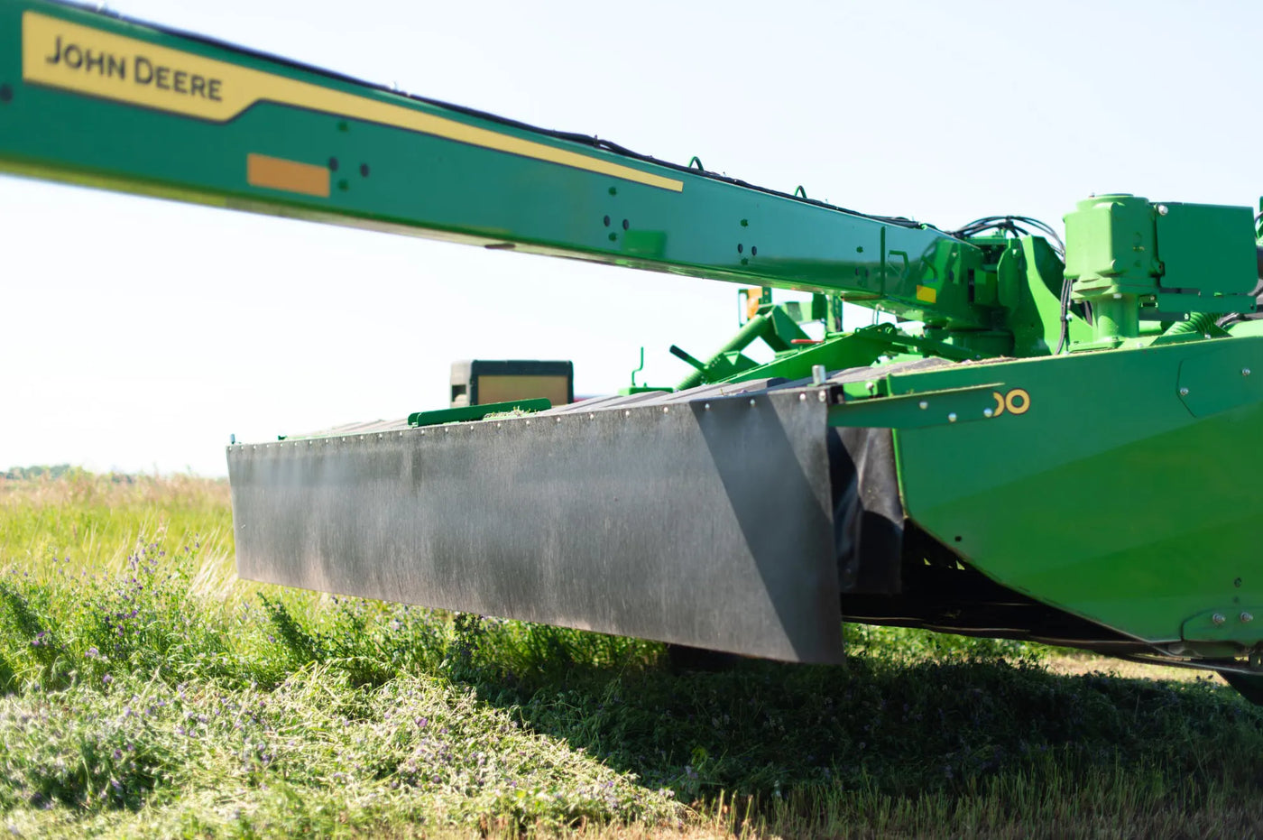 The Rock Block installed on a John Deere mower.