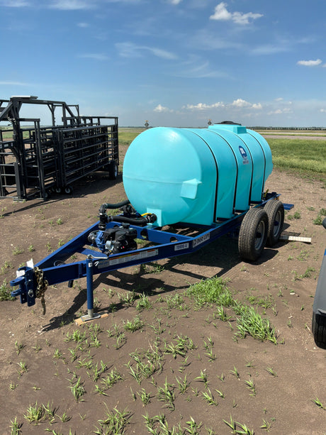 Teal Duo LIft water tank on a trailer in a field with crops.